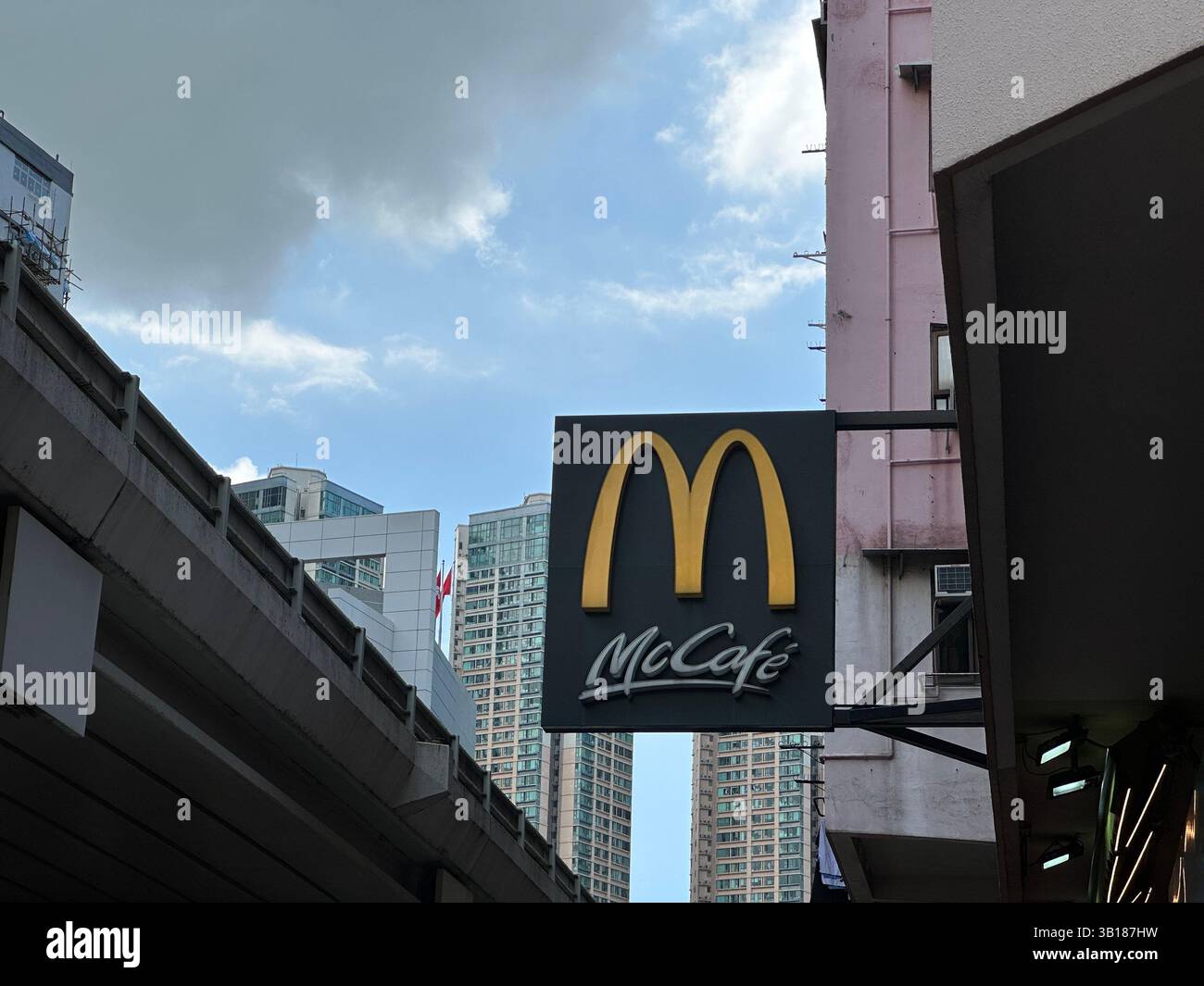 Hong Kong, Sep 20, 2023, McDonald's McCafe sign stands out with the iconic golden arches in a bustling city scene. - Smartphone Captured Stock Image