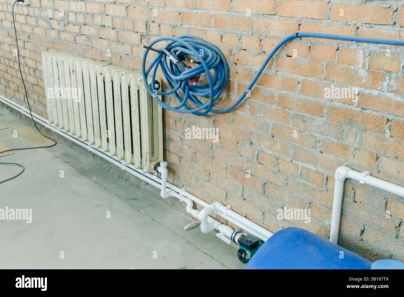 Cast iron heating radiator on a new heating system Stock Photo - Alamy