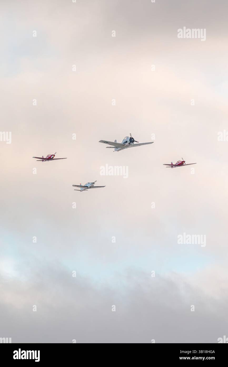 Propeller aircrafts flying in formation over the Dune du Pilat, France Stock Photo