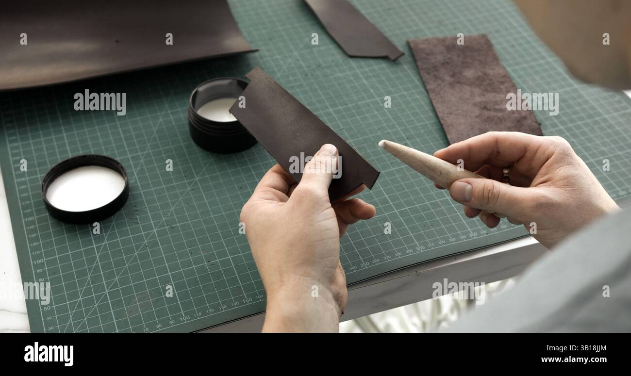 Preparing leather for edge finishing Stock Photo