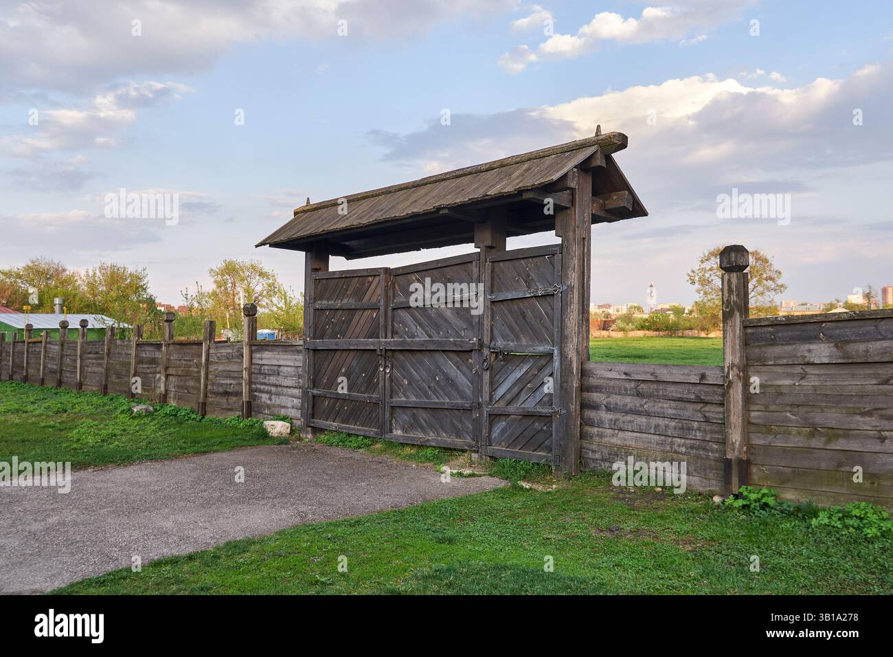 Old wooden gate on a clear spring day Stock Photo