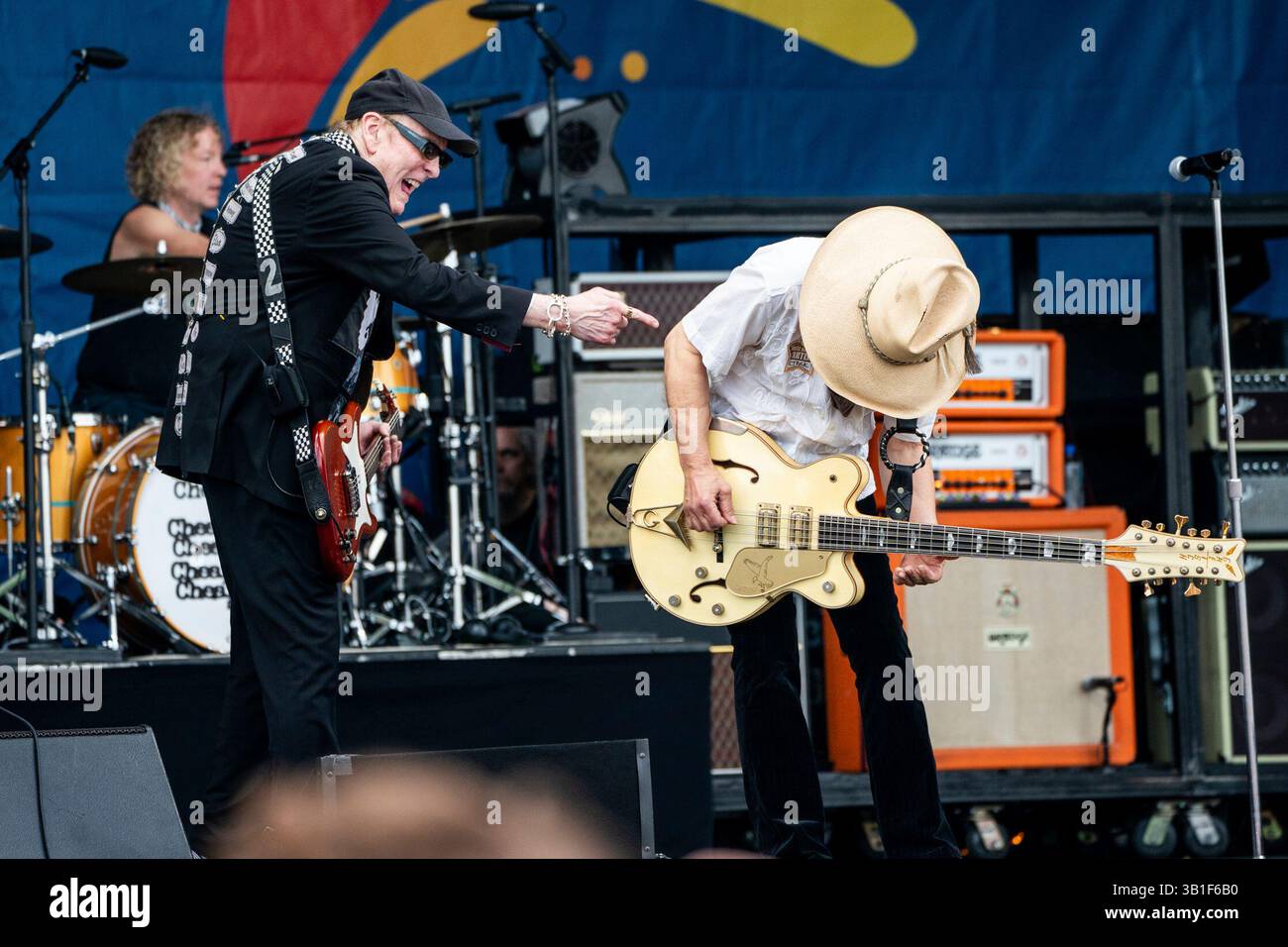 Rick Nielsen, left, and Tom Petersson of Cheap Trick perform during the