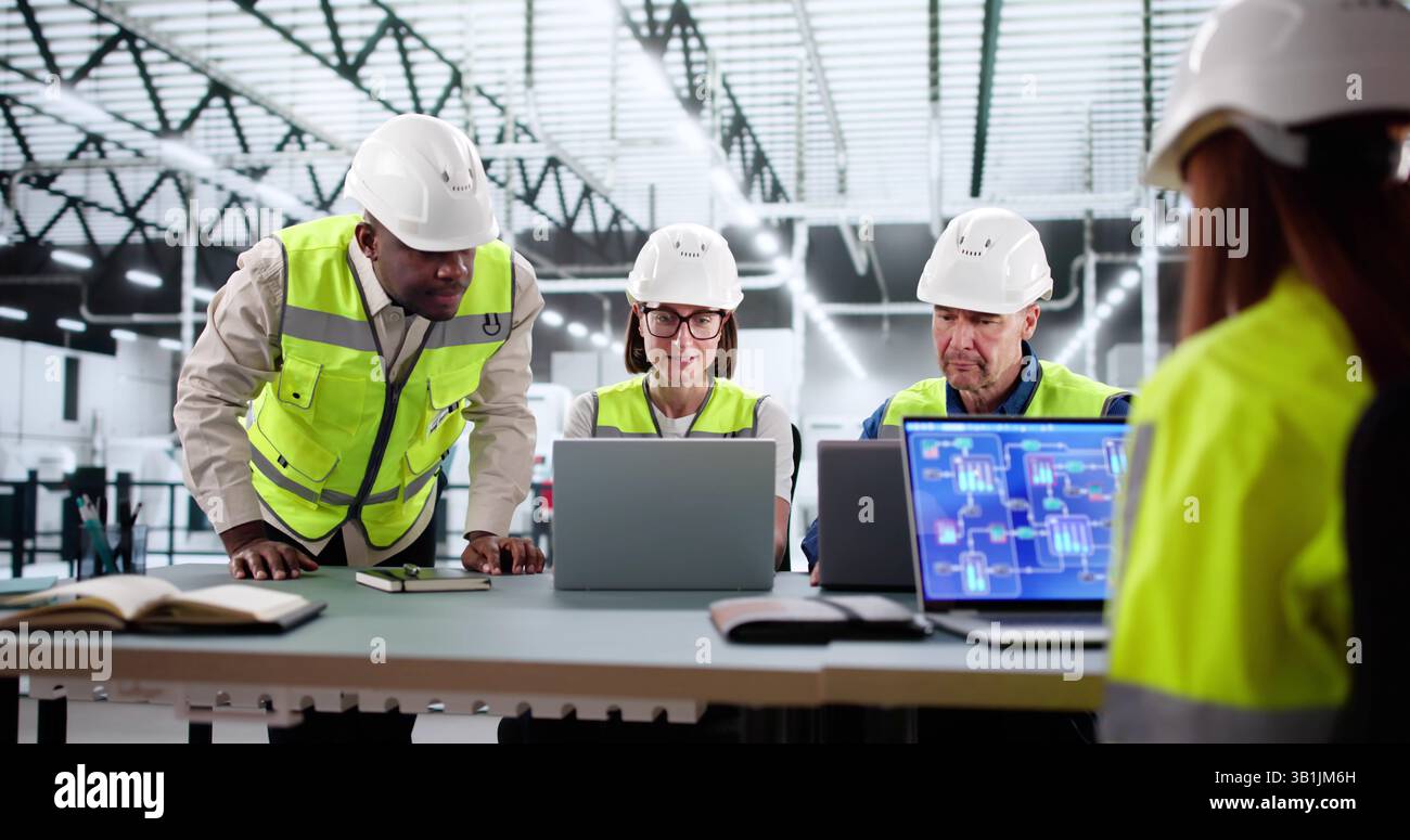 Senior Manager Oversees Diverse Group Working At Factory Assembly Line ...