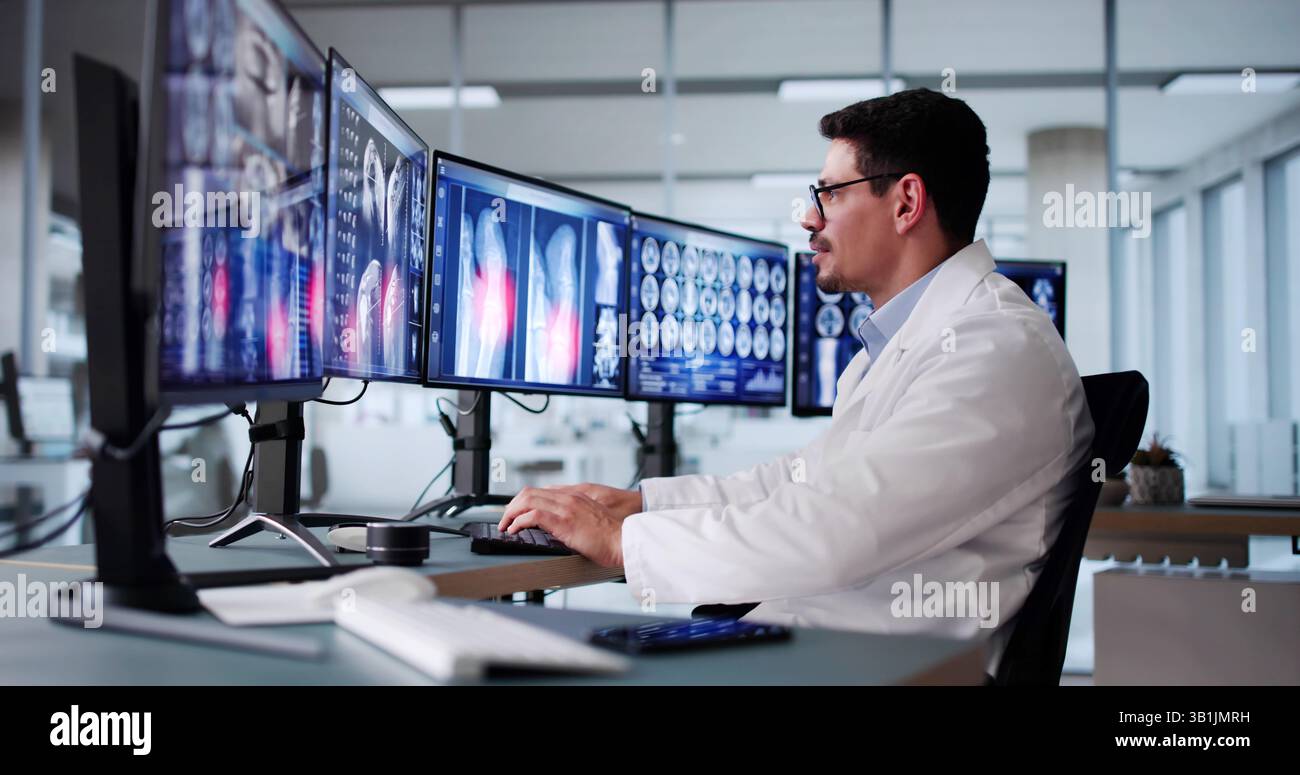 Radiologist Dentist Using X Ray Software On Desktop Computer Stock Photo