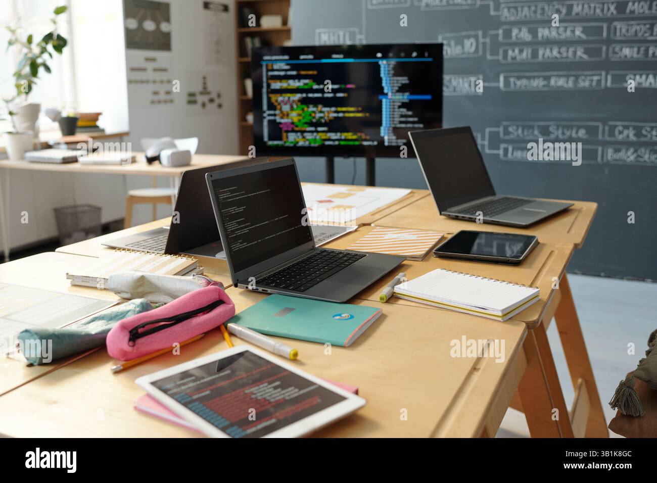 Coding and Developing in Modern Tech Office Stock Photo