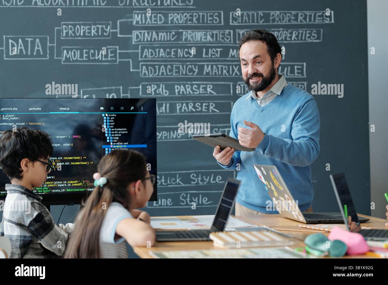 In school teacher engaging students hi-res stock photography and images ...