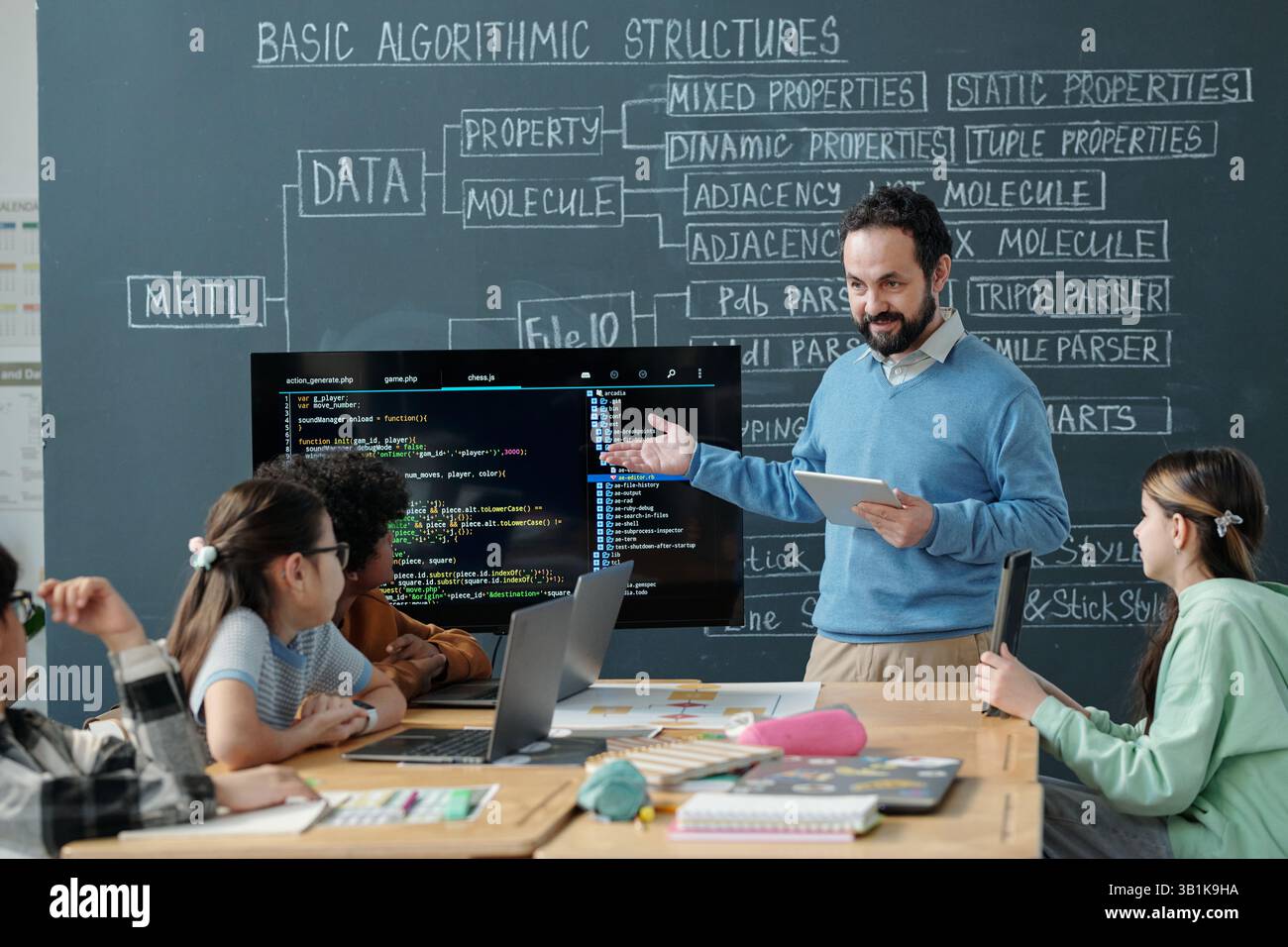 Teaching Programming Concepts in Classroom Setting Stock Photo
