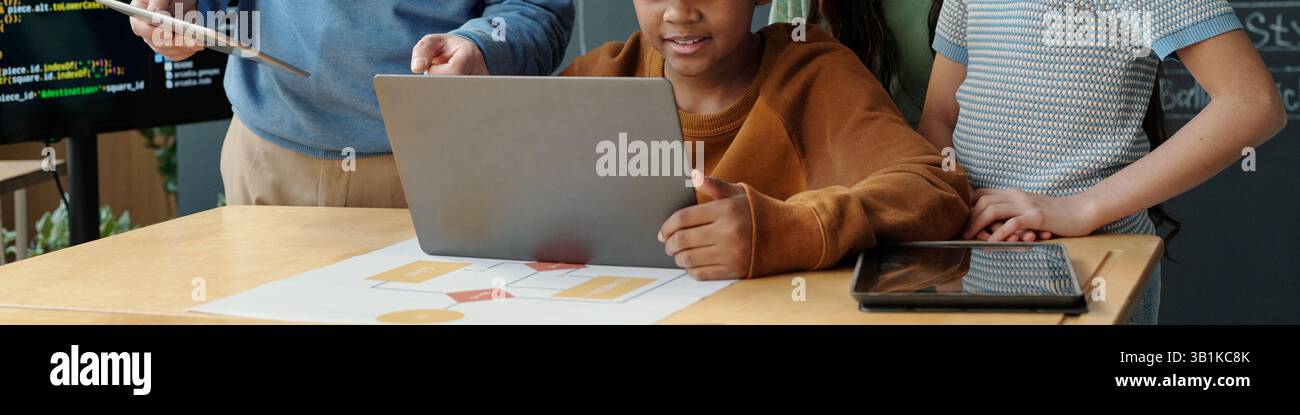 Collaborating on Project in Technology Classroom Stock Photo