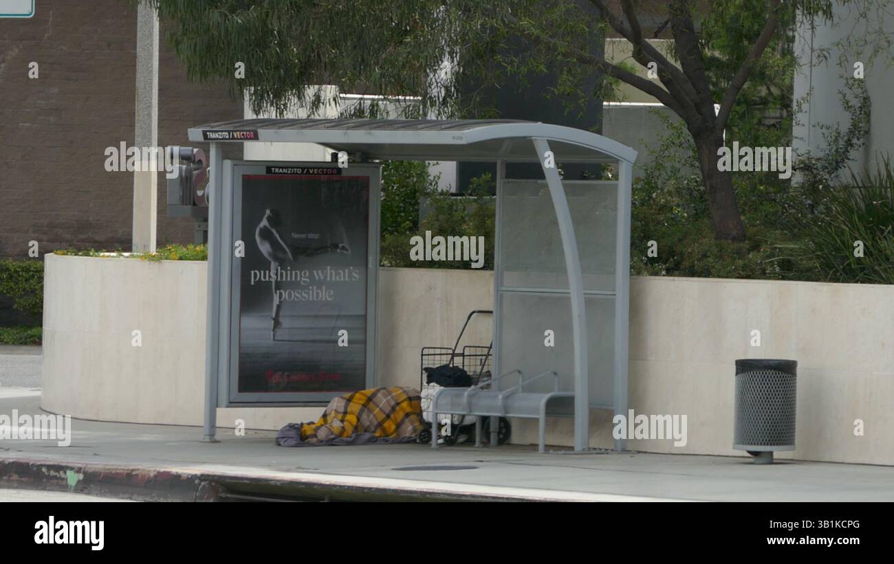 Homeless Bus Stop Los Angeles, California, USA 25th April 2025 Homeless at Bus Stop on ...