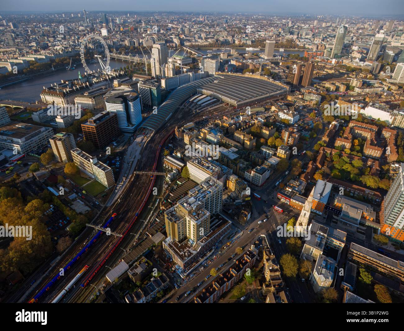 London from Above : Stunning aerial view of central London ft Waterloo Station, River Thames, London Eye, and city skyline captured in autumn light. Stock Photo