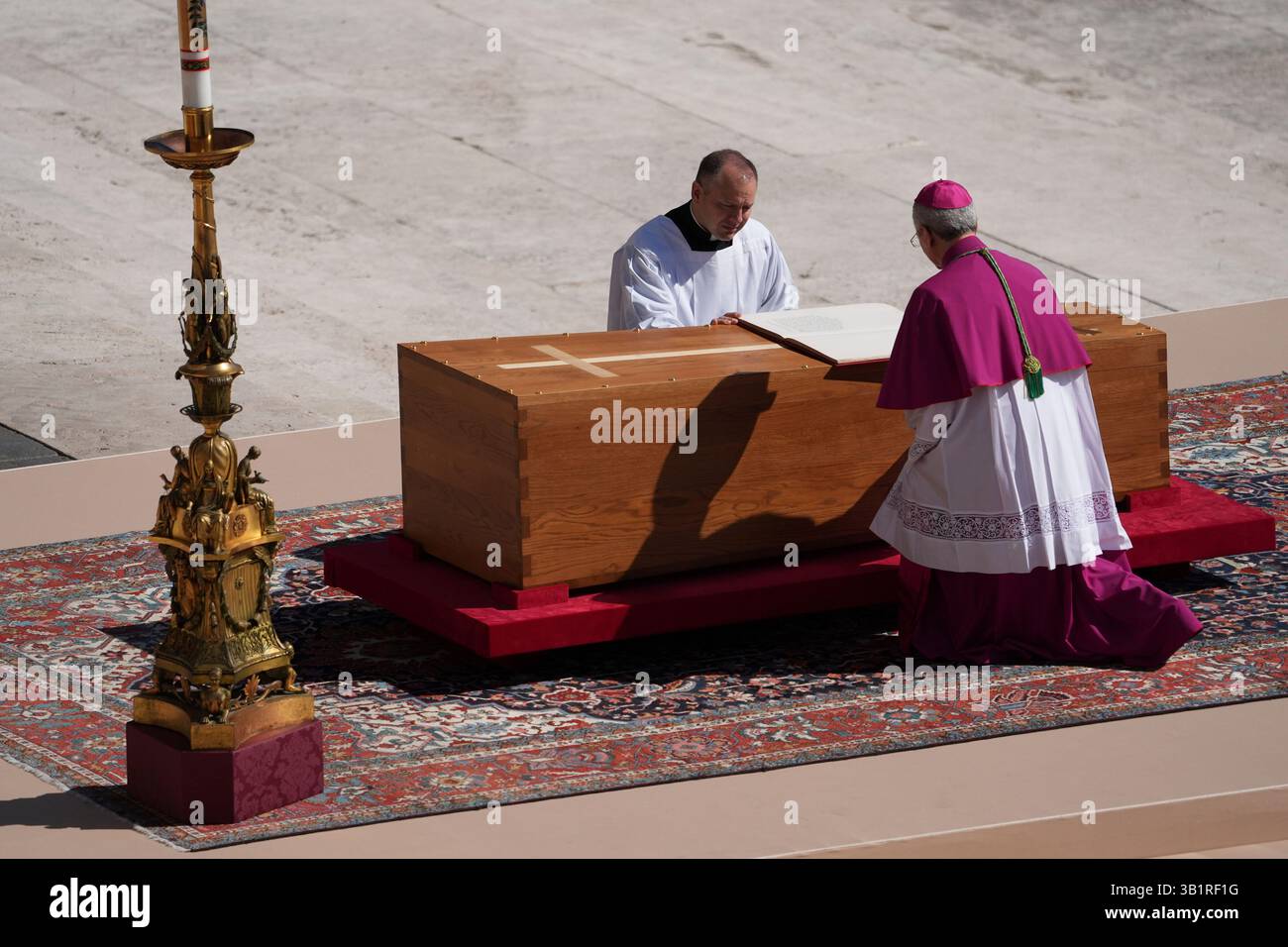 Archbishop Diego Giovanni Ravelli, kneeling right, presides over the ...