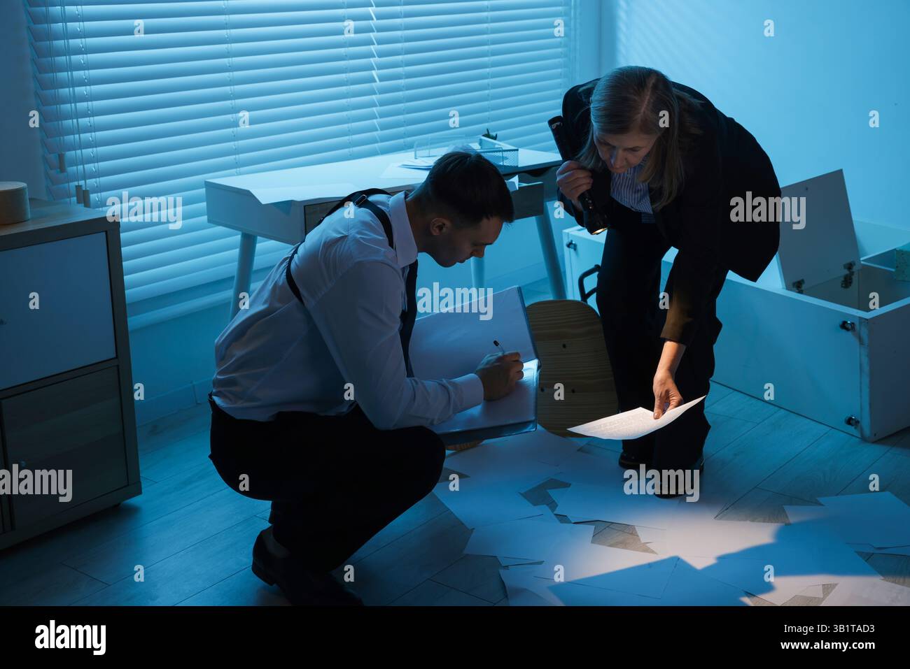 Forensic experts working at crime scene indoors Stock Photo - Alamy