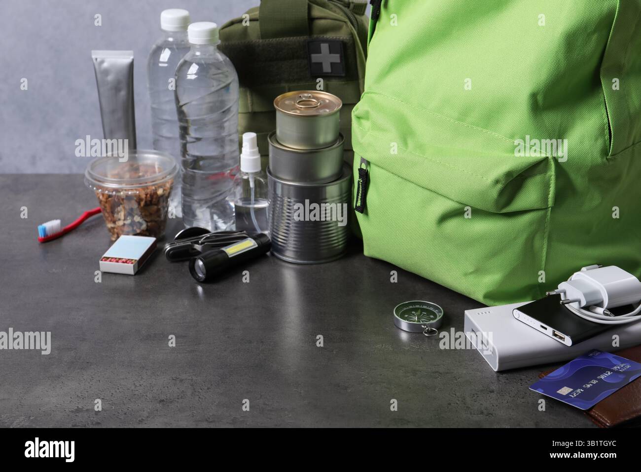 Survival kit. Different emergency supplies on grey table Stock Photo