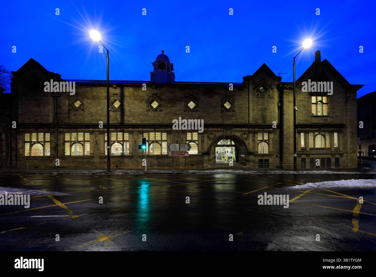 Dusk view of the public Library in Keighley town, Yorkshire, England ...