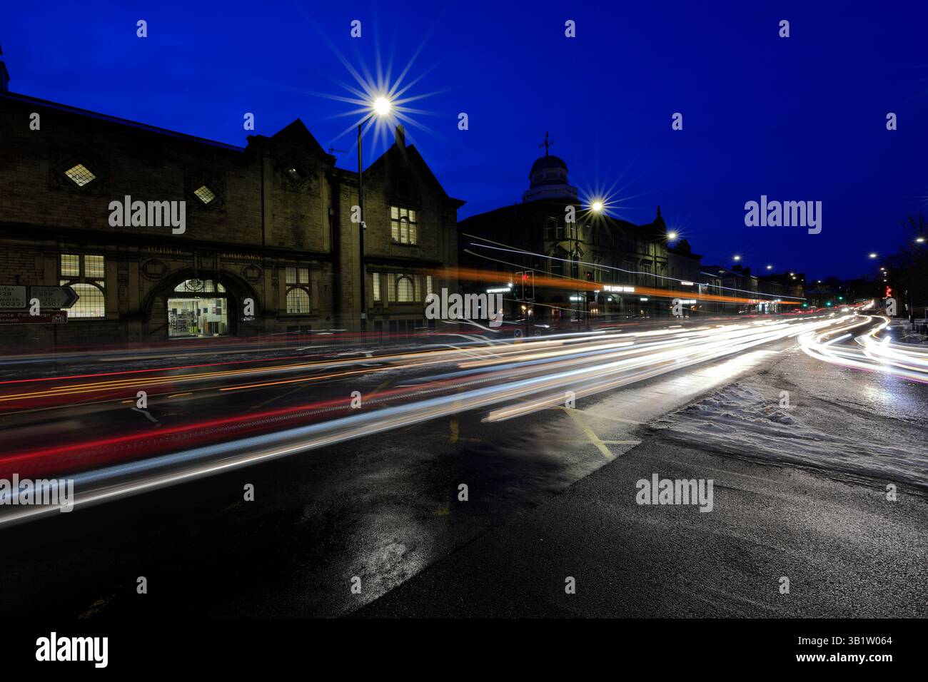 Dusk view of the public Library in Keighley town, Yorkshire, England ...