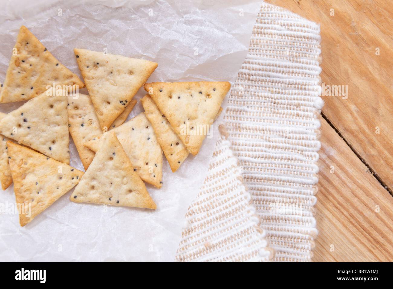 triangular crackers, dietary cereal with seeds Stock Photo