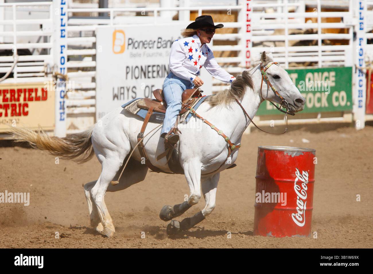 A woman competes in the barrel racing event at the 90th annual Black ...