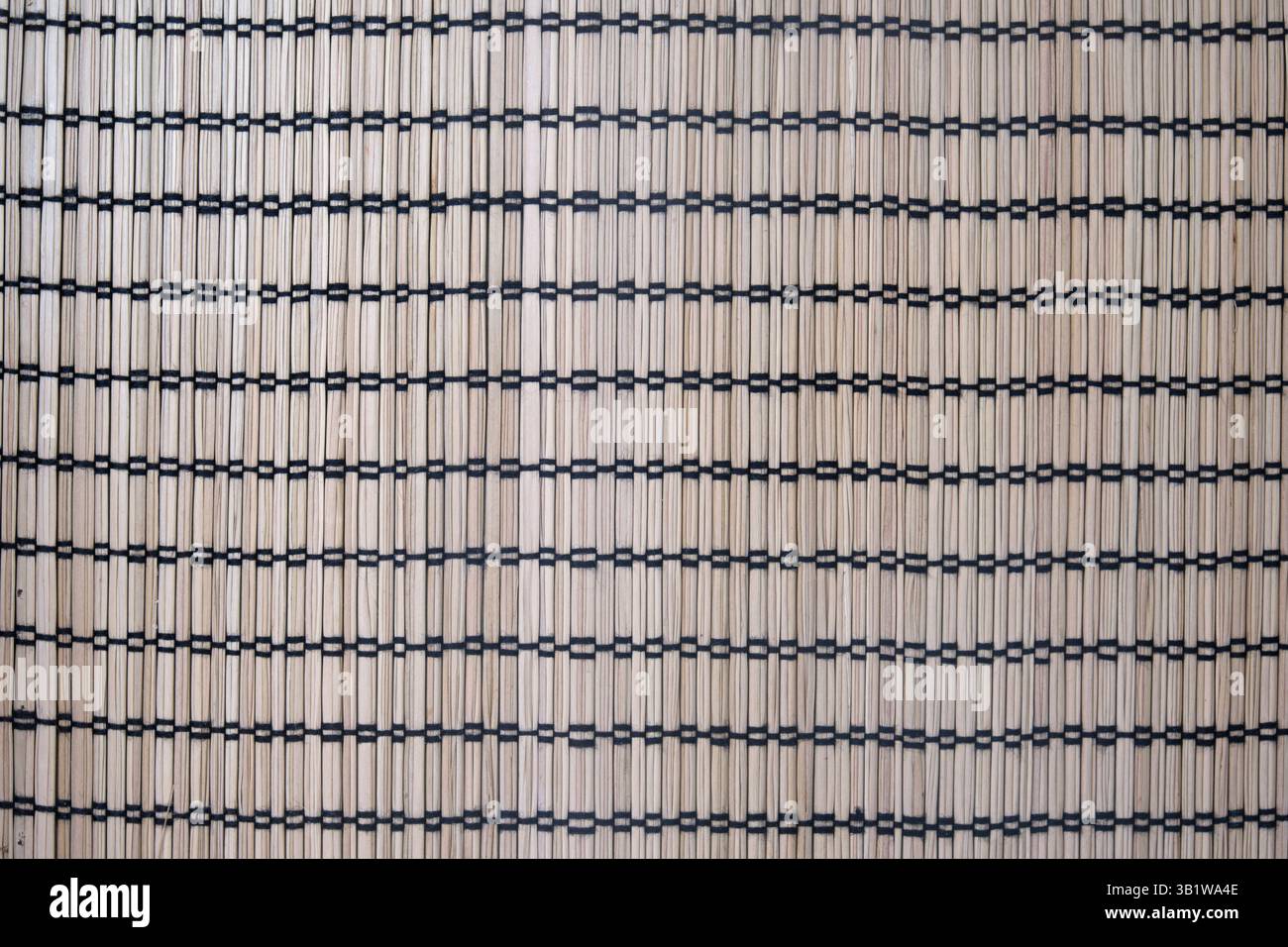 Natural bamboo mat with black thread grid pattern. Seamless woven ...