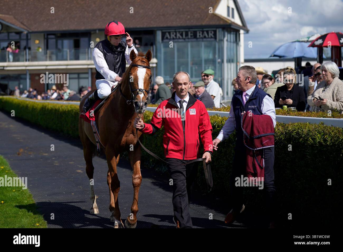 Jockey Ryan Moore on Kyprios in the parade ring after winning the Bar ...