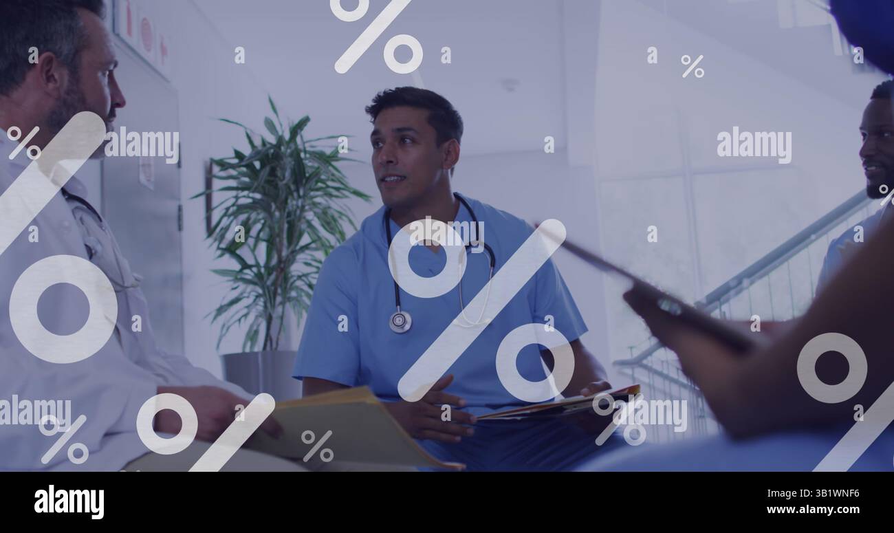 Image of percent data processing over diverse doctors using tablets Stock Photo