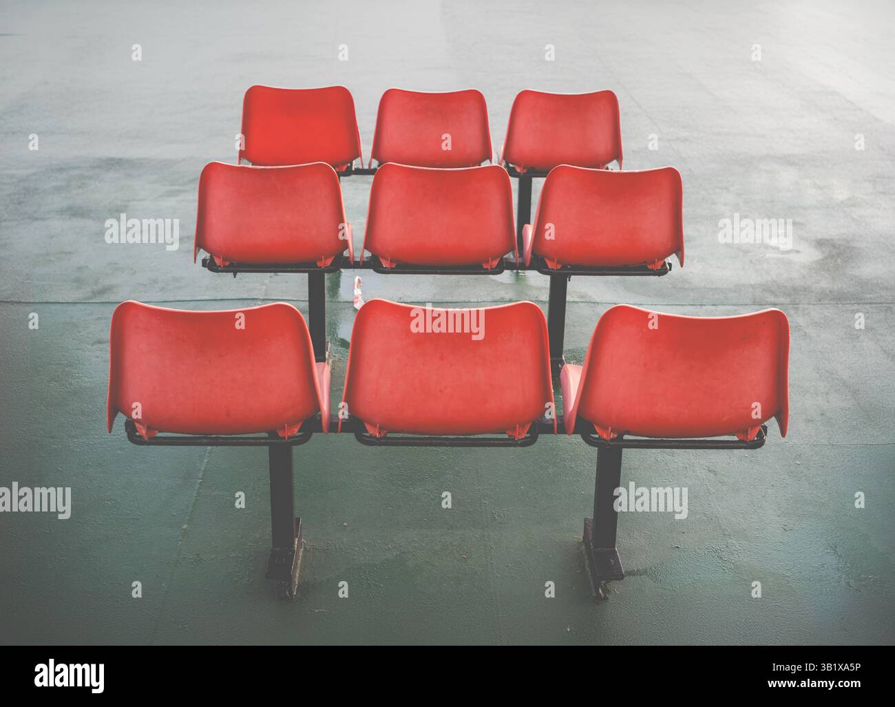 Three Rows Of Three Uncomfortable Orange Plastic Chairs In A Waiting ...