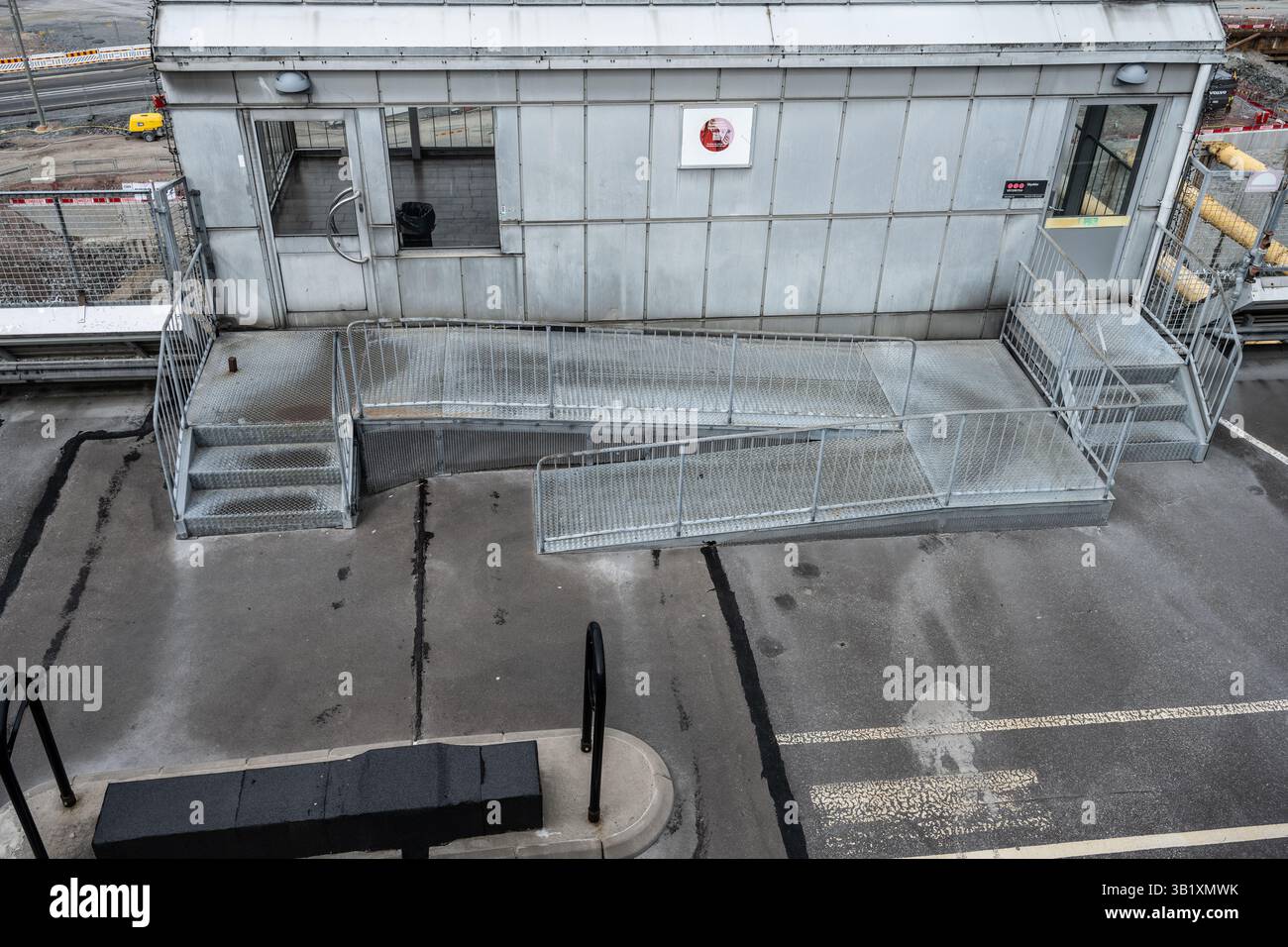 Metal ramp and stairs outside industrial structure Stock Photo - Alamy