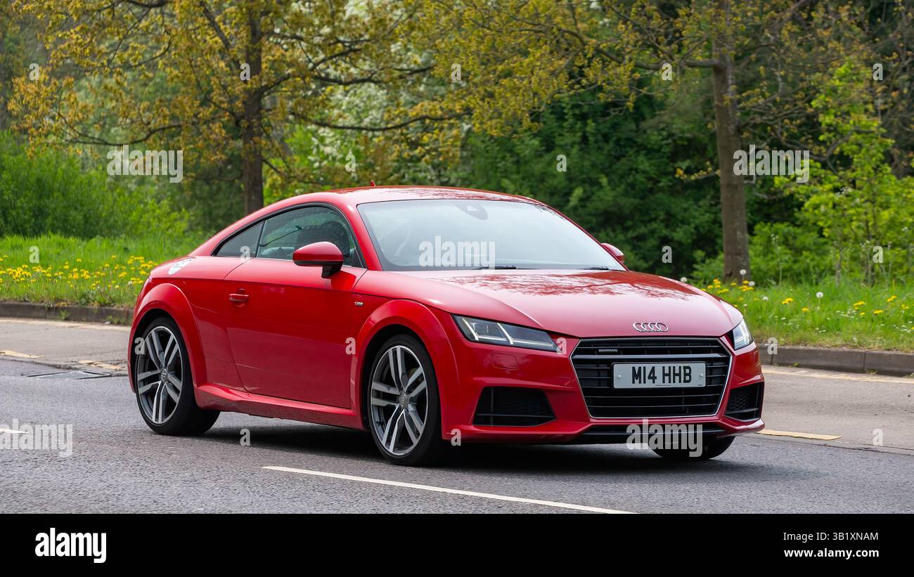Milton Keynes,UK - Apr 26th 2025: 2016 red Audi tt car driving on a British road Stock Photo
