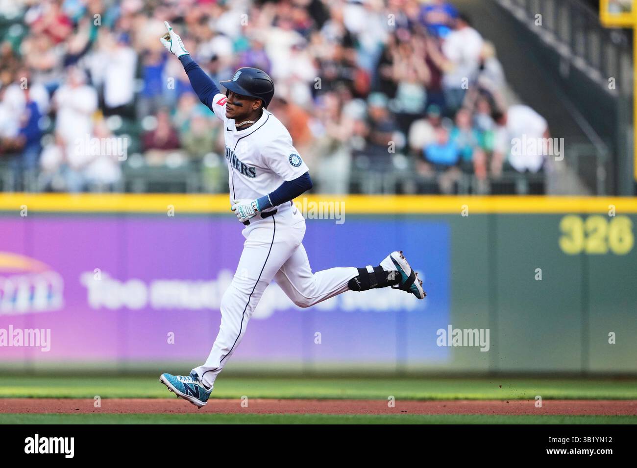 Seattle Mariners' Jorge Polanco runs the bases after hitting a solo