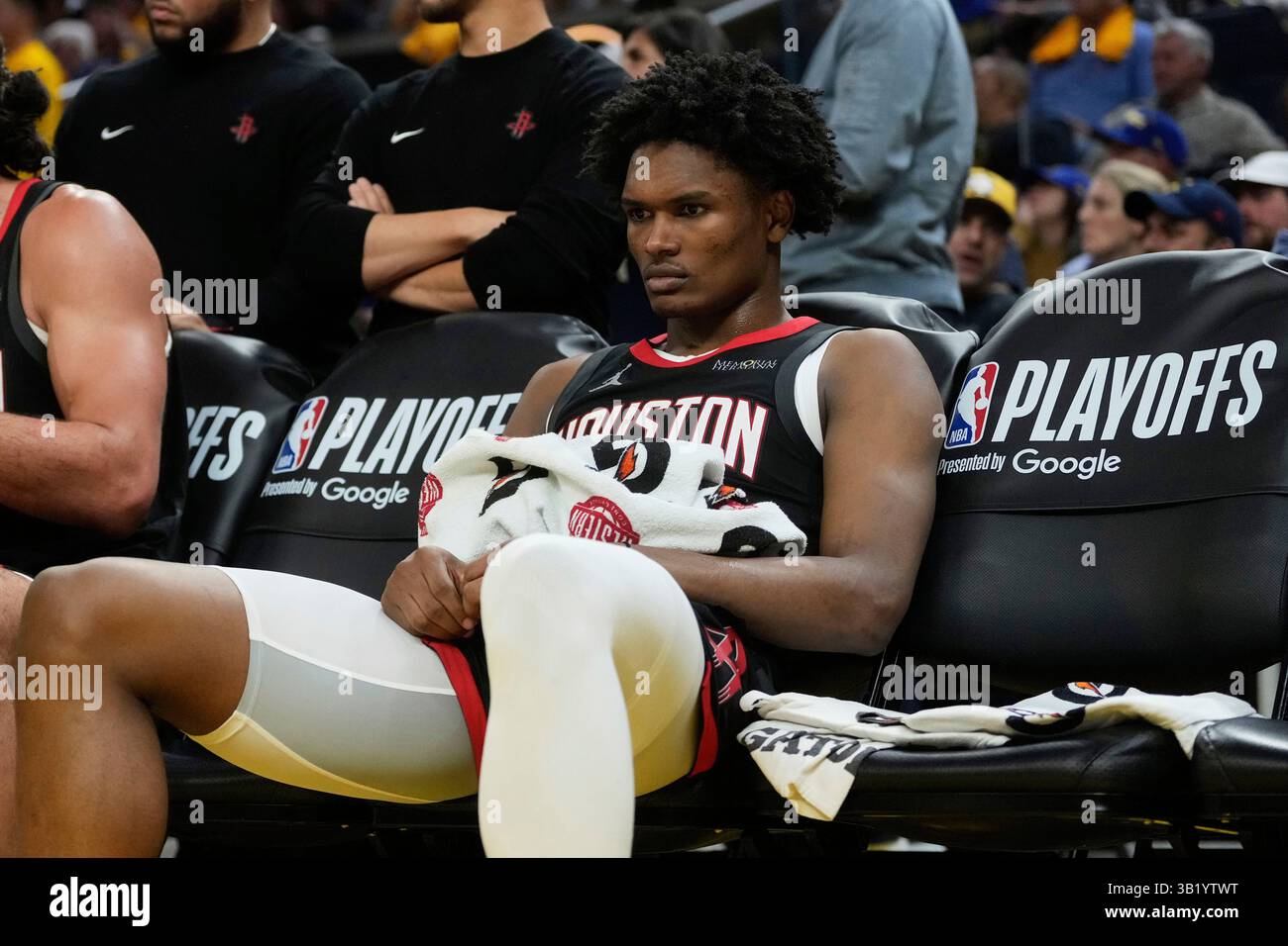 Houston Rockets forward Amen Thompson reacts on the bench during the