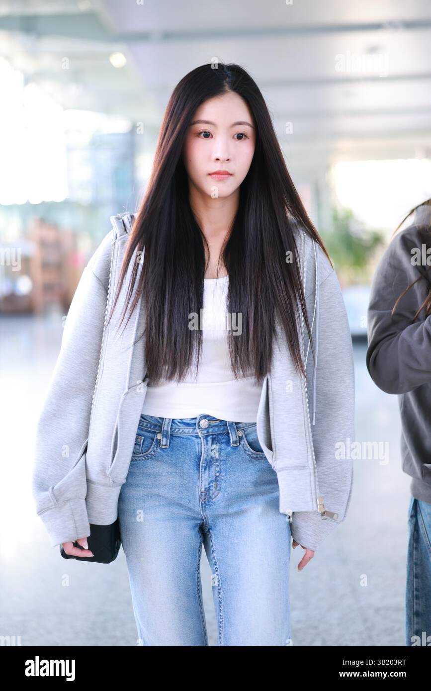 Chinese singer, dancer, and actress Sun Rui appears at the airport in ...