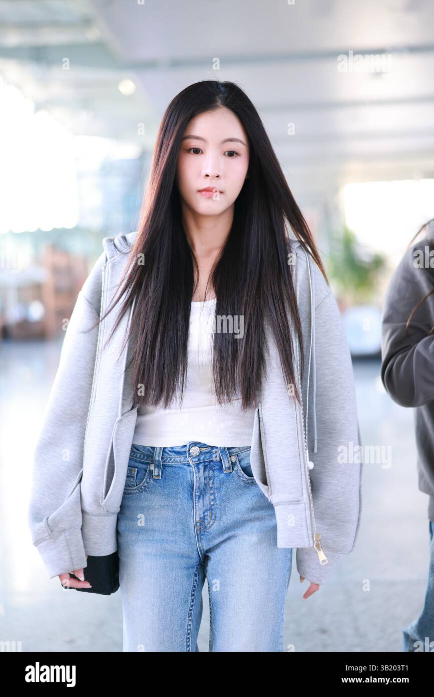 Chinese singer, dancer, and actress Sun Rui appears at the airport in ...