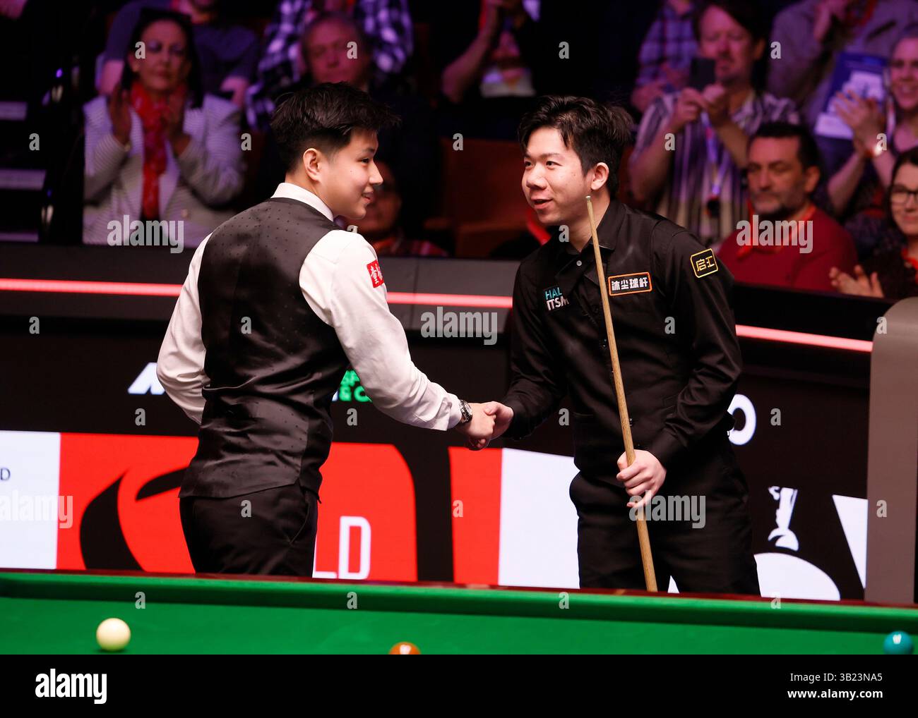 Zhao Xintong Left Shakes Hands With Lei Peifan Right After Winning His Match During Day Nine Zhao Xintong Left Shakes Hands With Lei Peifan Right After Winning His Match During Day Nine