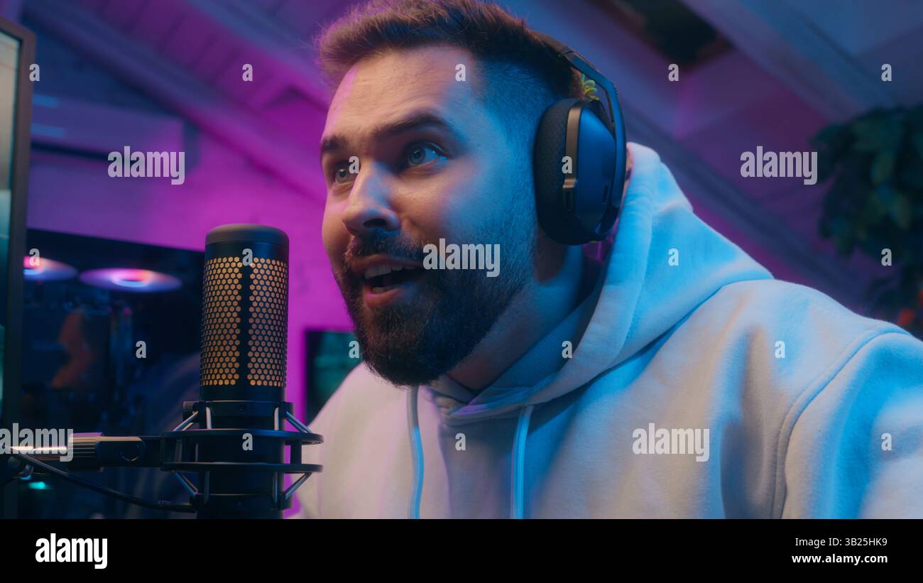 Joyful Caucasian male guy gamer streamer playing computer tech e-sport at home man winning shout winner rejoice addict influencer celebrate game Stock Photo