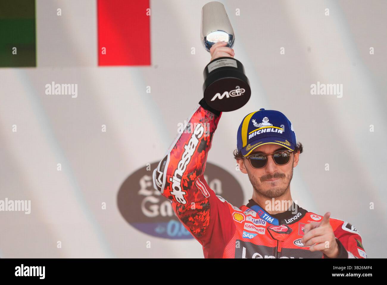 Third placed Italian rider Francesco Bagnaia of the Ducati Lenovo Team ...