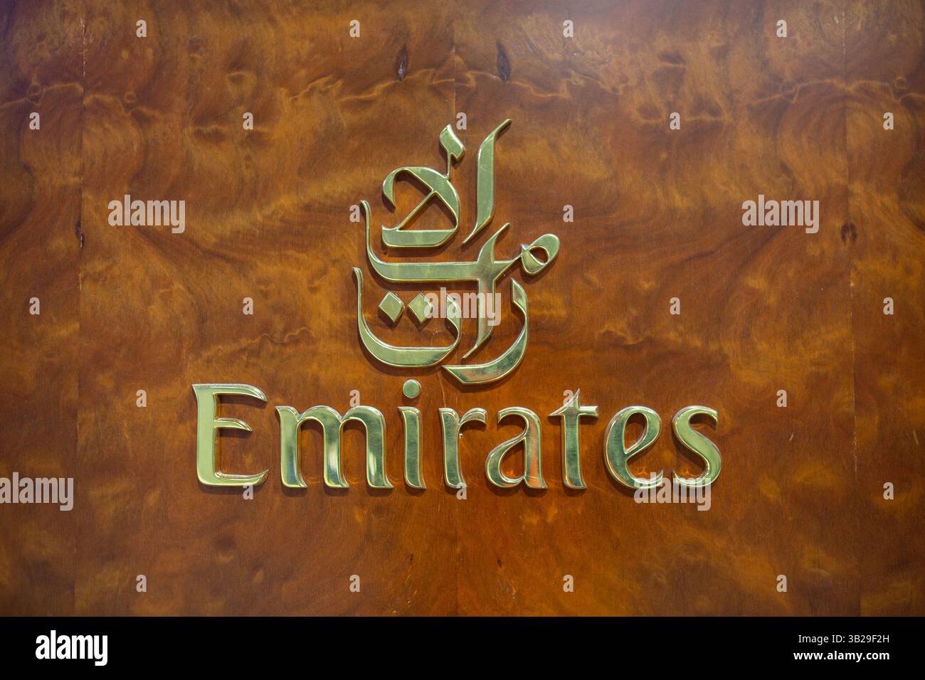 Dubai, United Arab Emirates - April 24: 2025: Logotype of the Emirates Airlines at Dubai International Airport. Stock Photo