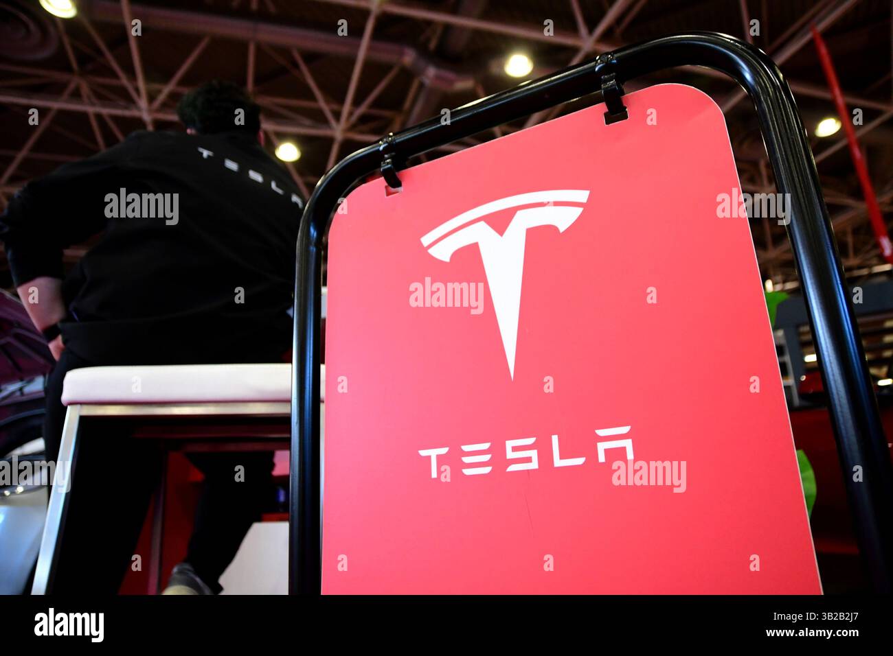 Tesla car brand exhibition poster seen at the Lyon fair. The Lyon Fair ...