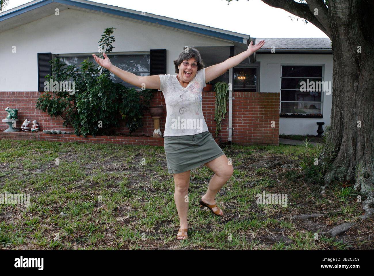 JIM DAMASKE   |   Times.NP 311908 DAMA IamALIVE 1  (9/14//2009 SEMINOLE)  ''I'm alive,'' says Mary Hoffman infront of her Seminole home. - Mary Hoffman of Seminole lost her father in August. But in a series of goofups by the Pinellas County property appraiser's office, she lost her property rights. The office stripped her name from ownership, along with her homestead exemption and Save Our Homes cap. When she finally got it corrected, the office said its employees read death notices in the paper and make changes. Huffman never was part of a death notice.   [JIM DAMASKE, Times] (Credit Image: © Stock Photo