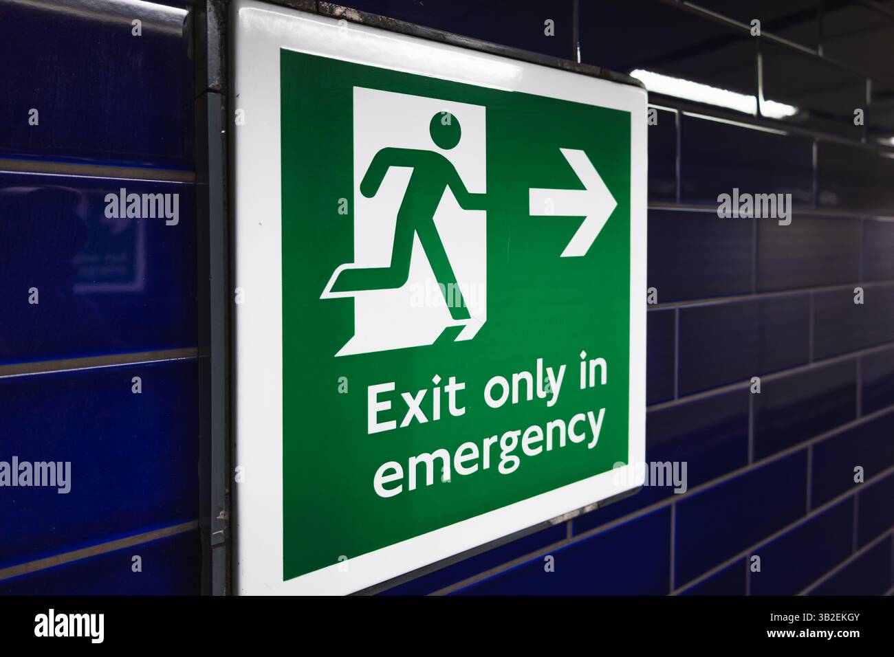 Run To Emergency Emergency Exit Sign with Running Man and Arrow Stock Photo - Alamy