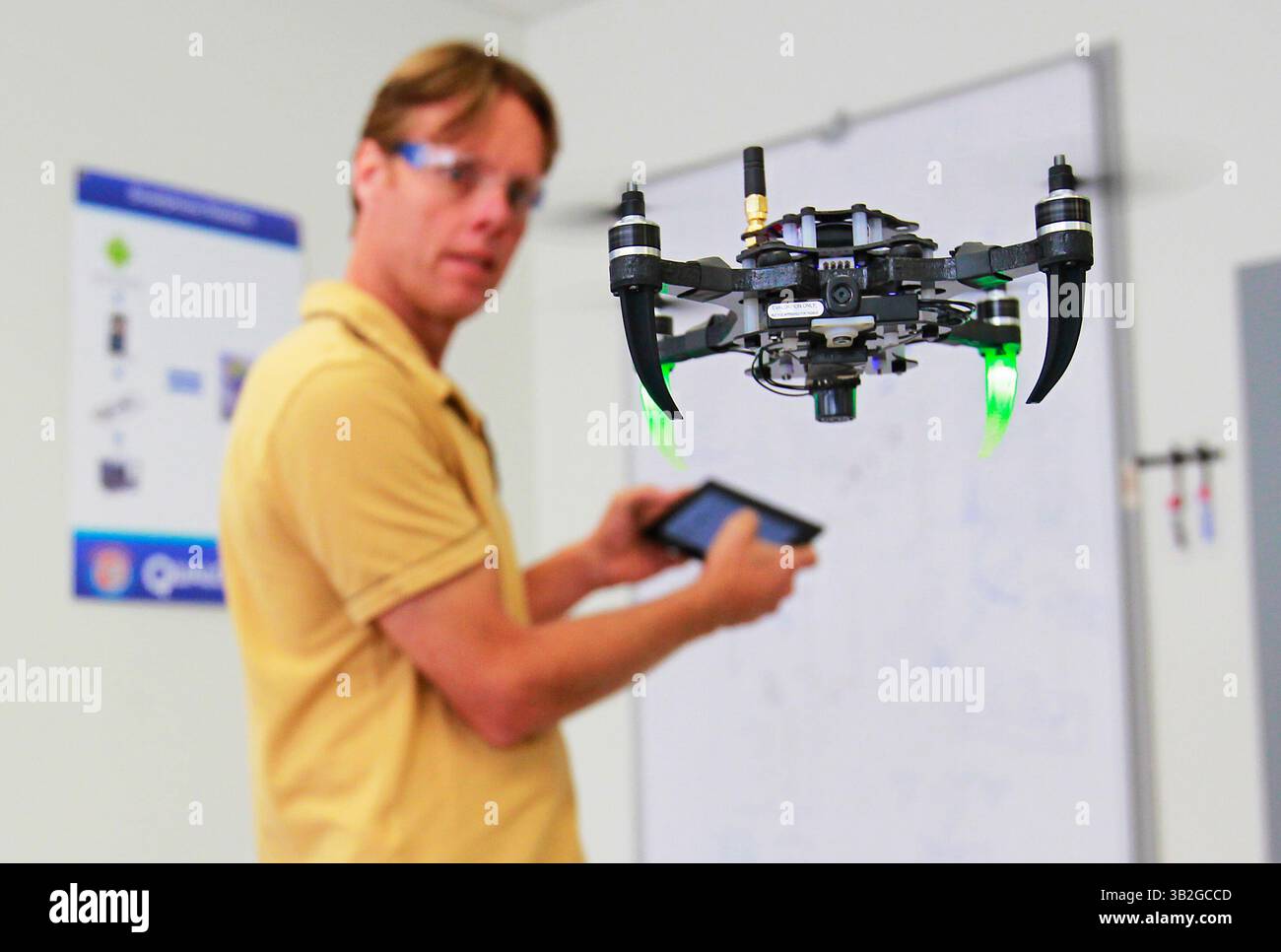 Nov. 18, 2015 - San Diego, CA, USA - SAN DIEGO, CA -NOVEMBER 18, 2015 | Donald Hutson, Sr. Support Staff Engineer at Qualcomm flies the Snapdragon Flight mini drone, one of worldÃ¢â‚¬â„¢s smallest 4K drones, in the research robotics lab.  | (K.C. Alfred/ San Diego Union-Tribune (Credit Image: © K.C. Alfred/U-T San Diego via ZUMA Wire) Stock Photo