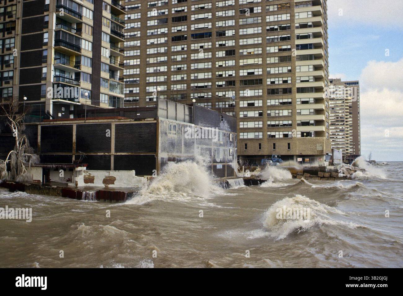 Sept. 4, 2015 - Chicago, Illinois, United States of America - Chicago, Illinois 2-8-1987.A powerful storm produced blizzard conditions in the Great Lakes region. North winds of 50 to 70 mph raised the water level of southern Lake Michigan two feet, and produced waves 12 to 18 feet high, seen here batterig seawalls of condo's and coating them  with ice up to the 3rd floor. .Credit: Mark Reinstein (Credit Image: © Mark Reinstein via ZUMA Wire) Stock Photo