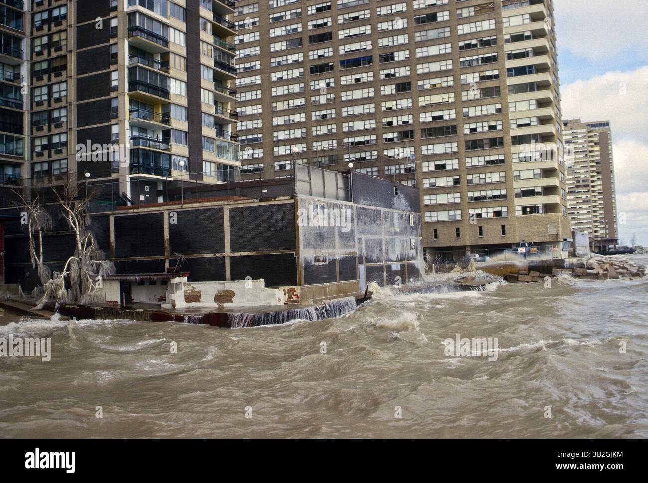 Sept. 4, 2015 - Chicago, Illinois, United States of America - Chicago, Illinois 2-8-1987.A powerful storm produced blizzard conditions in the Great Lakes region. North winds of 50 to 70 mph raised the water level of southern Lake Michigan two feet, and produced waves 12 to 18 feet high, seen here batterig seawalls of condo's and coating them  with ice up to the 3rd floor. .Credit: Mark Reinstein (Credit Image: © Mark Reinstein via ZUMA Wire) Stock Photo