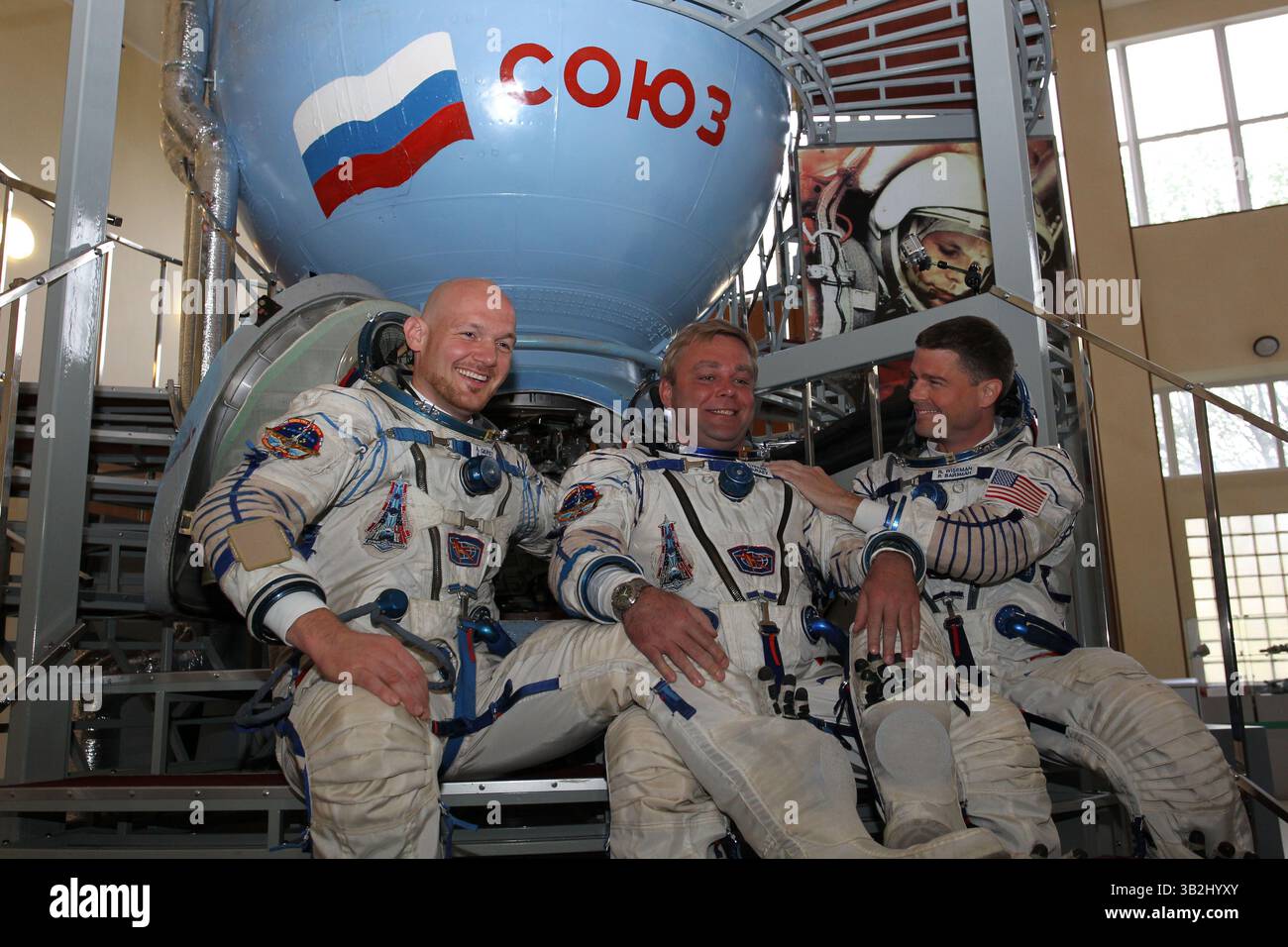 May 6, 2014 - Star City, Russia - International Space Station Expedition 40 crew members ESA astronaut Alexander Gerst, left, Soyuz commander Max Suraev, center, and NASA astronaut Reid Wiseman pose in front of a Soyuz simulator at the Gagarin Cosmonaut Training Center May 6, 2015 in Star City, Russia. (Credit Image: © Stephanie Stoll/Planet Pix via ZUMA Wire) Stock Photo