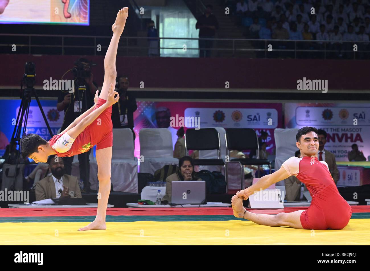 NEW DELHI, INDIA - APRIL 26: Participants perform yoga during the 2…