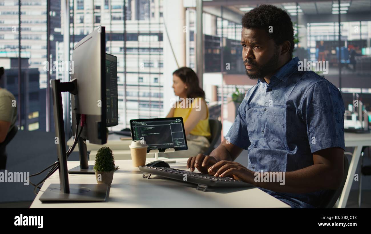 Data scientist developing and maintaining machine learning APIs solving complex problems. Man training predictive models capable of handling tasks such as language processing, camera B Stock Photo