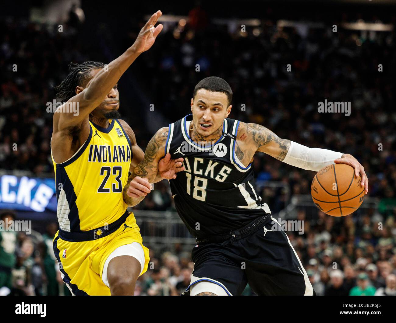 Milwaukee Bucks' Kyle Kuzma (18) drives against the Indiana Pacers