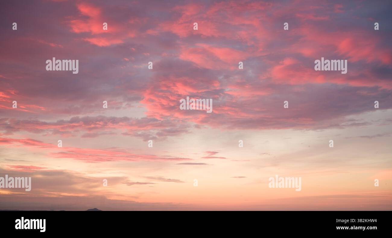 Pink Clouds at Sunset: Sky Beauty. Stock Photo