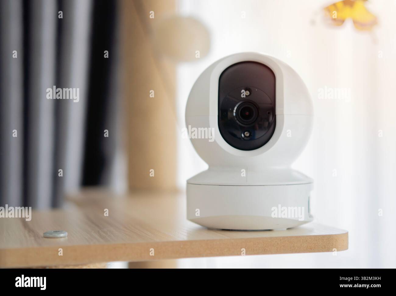 IP wireless CCTV camera indoor device control camera setting on cat tower at home. Security with pet concept. Selective focus. Stock Photo