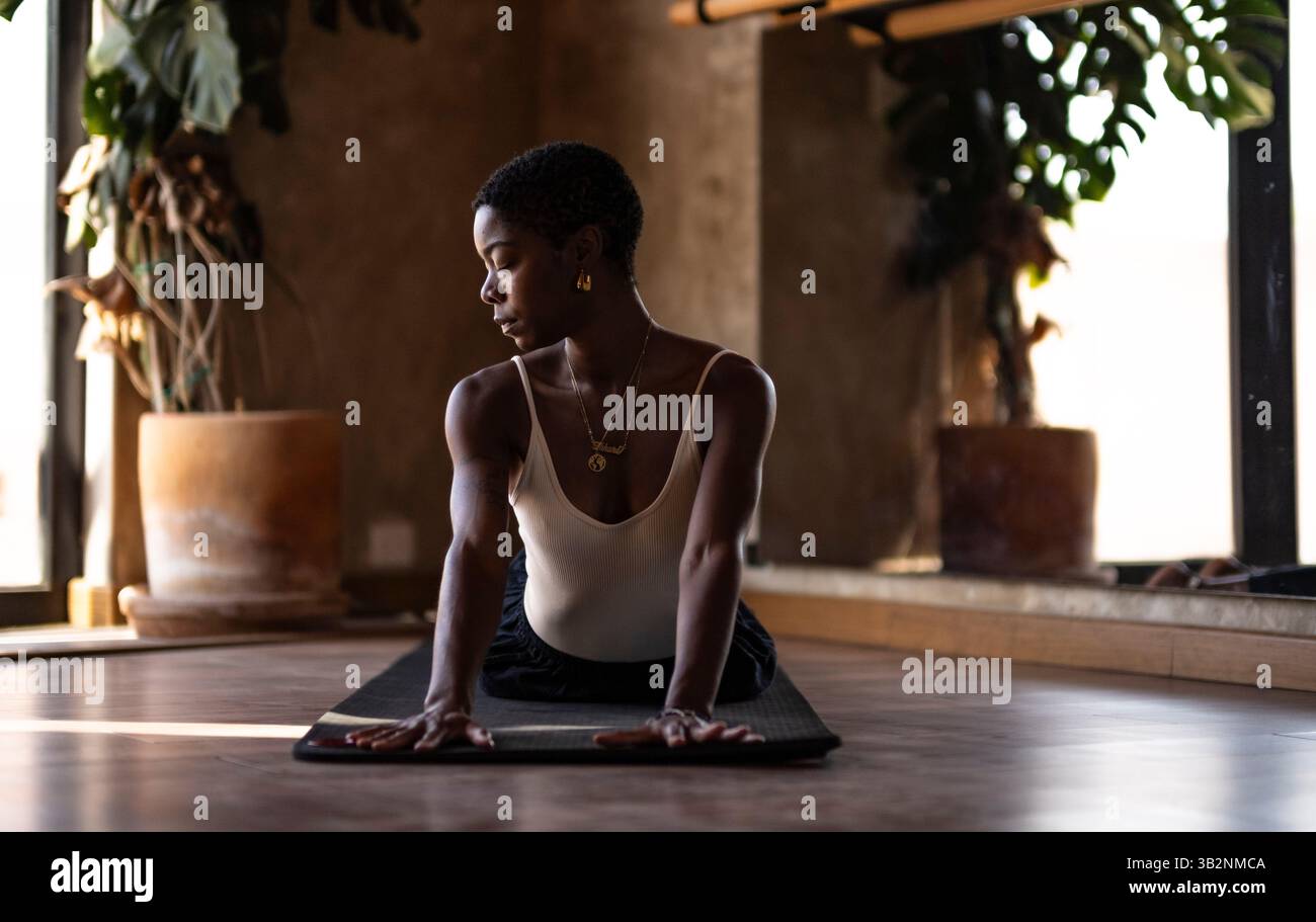 Woman in black top indoors hi-res stock photography and images - Alamy