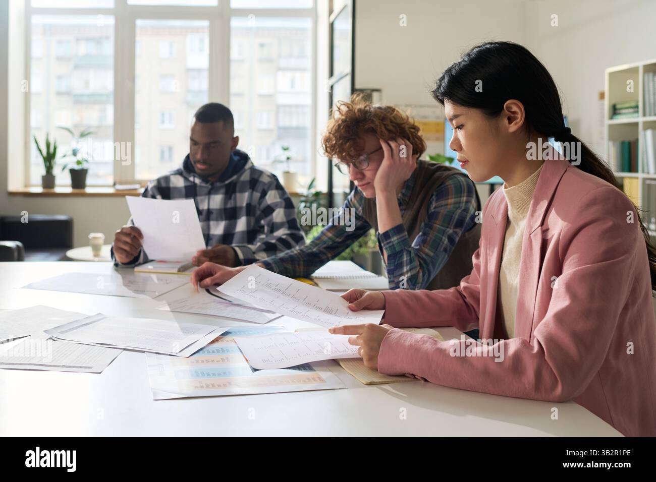 Studying Foreign Languages in Collaborative Classroom Setting Stock Photo
