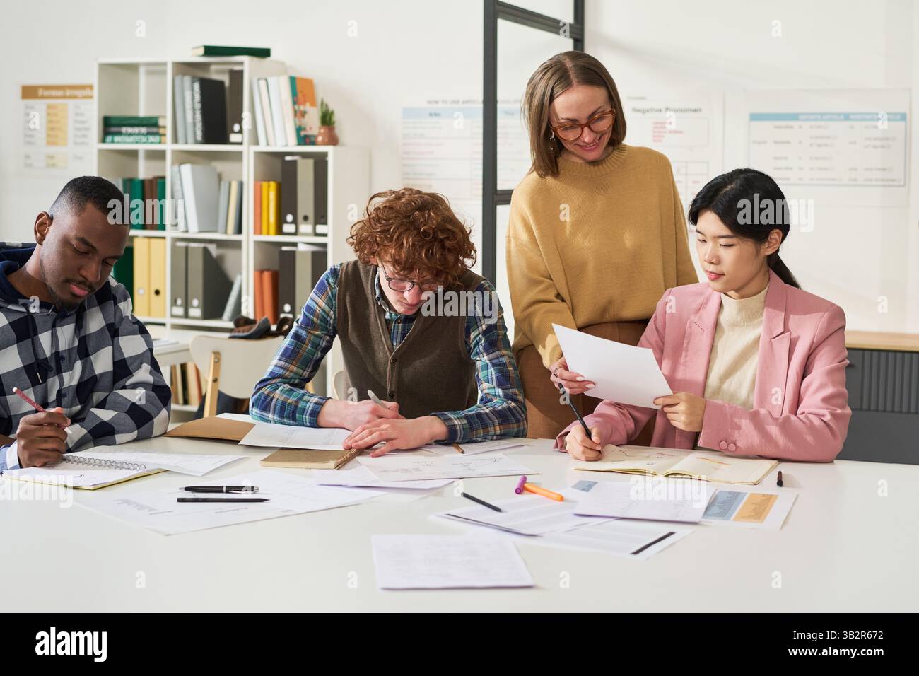 Studying Foreign Languages in Modern Classroom Setting Stock Photo